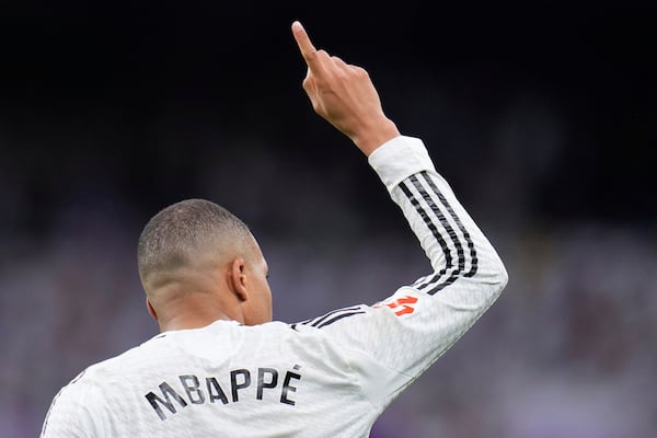 Real Madrid's Kylian Mbappe celebrates after scoring his side's opening goal during the Spanish La Liga soccer match between Real Madrid and Rayo Vallecano at the Santiago Bernabeu stadium in Madrid, Spain, Sunday, March 9, 2025. (AP Photo/Manu Fernandez)