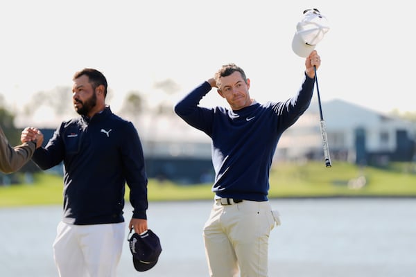 Rory McIlroy, right, of Northern Ireland, reacts after winning a playoff round of The Players Championship golf tournament against J.J. Spaun, left, Monday, March 17, 2025, in Ponte Vedra Beach, Fla. (AP Photo/Julia Demaree Nikhinson)