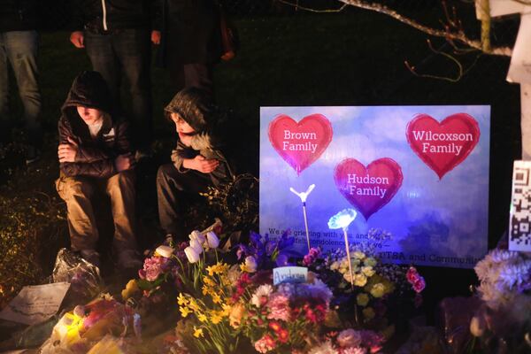 People gather in Renton, Wash., March 22, 2024, for a vigil honoring the four people killed in a car crash, Andrea Hudson, Matilda Wilcoxson, Eloise Wilcoxson and Boyd "Buster" Brown. (Ellen M. Banner/The Seattle Times via AP)