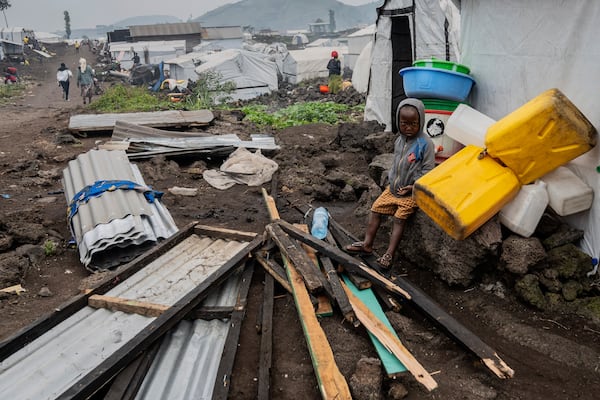 A child displaced by the fighting between M23 rebels and government soldiers prepare to leave the camp following an instruction by M23 rebels in Goma, Democratic Republic of the Congo, Tuesday, Feb. 11, 2025. (AP Photo/Moses Sawasawa)