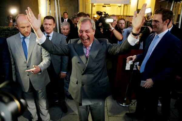 FILE - In this Friday, June 24, 2016 file photo Nigel Farage, the leader of the UK Independence Party, celebrates and poses for photographers as he leaves a "Leave.EU" organisation party for the British European Union membership referendum in London. (AP Photo/Matt Dunham, File)