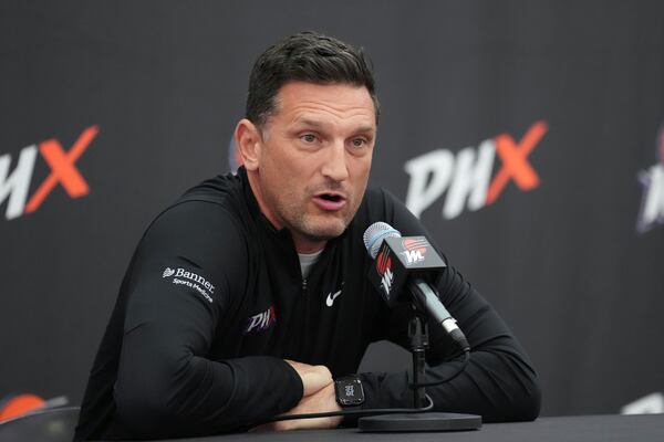 Phoenix Mercury head coach Nate Tibbetts answers a quesion from the media during Mercury Media Day at the team's WNBA basketball training facility, Wednesday, April 30, 2025, in Phoenix. (AP Photo/Ross D. Franklin)