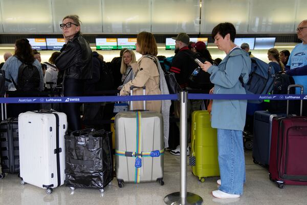 Travelers wait to check into their flights at Newark Liberty International Airport in Newark, N.J., Monday, May 5, 2025. (AP Photo/Seth Wenig)