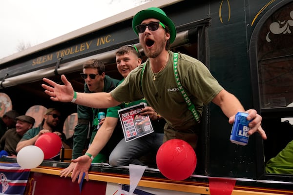 A man on a float encourages the crowd to cheer louder during the St. Patrick's Day parade, Sunday, March 16, 2025, in Boston, Mass. (AP Photo/Robert F. Bukaty)