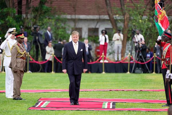 King Willem-Alexander of the Netherlands reviews the honor guard after arriving to meet with Kenya's President William Ruto at State House in Nairobi, Kenya, Tuesday, March. 18, 2025. (AP Photo/Brian Inganga)