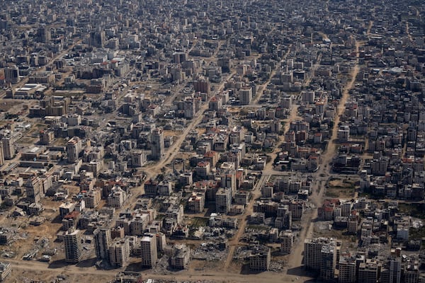 FILE - Destroyed buildings are seen through the window of an airplane from the U.S. Air Force overflying the Gaza Strip, on March 14, 2024. (AP Photo/Leo Correa, File)