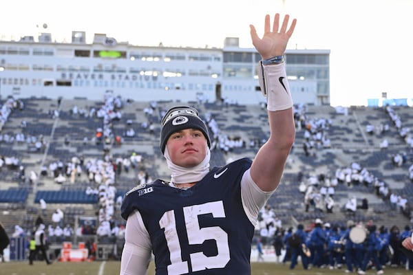 Penn State quarterback Drew Allar waves after a victory over SMU during the first round of the College Football Playoff, Saturday, Dec. 21, 2024, in State College, Pa. (AP Photo/Barry Reeger)