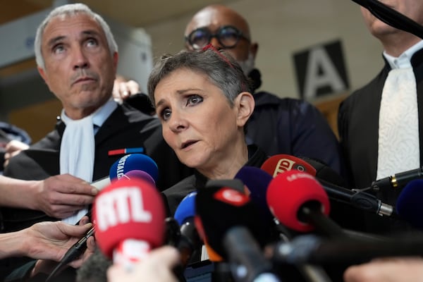 FILE - Lawyer Beatrice Zavarro talks to the media in the Avignon courthouse, southern France, Thursday, Dec. 19, 2024. (AP Photo/Lewis Joly, File)