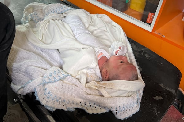 Ella Osama Abu Dagga, 25 days old, lies in a van after being pulled from the rubble following an Israeli army airstrike that killed her parents and brother in Khan Younis, southern Gaza Strip, Thursday, March 20, 2025. (AP Photo/Mariam Dagga)