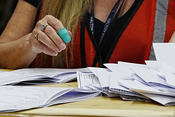 Votes are counted at DCBL Halton Stadium, in Widnes, Cheshire, England, for the Runcorn and Helsby by-election that was triggered by the resignation of former Labour MP Mike Amesbury, Thursday, May 1, 2025. (Peter Byrne/PA via AP)