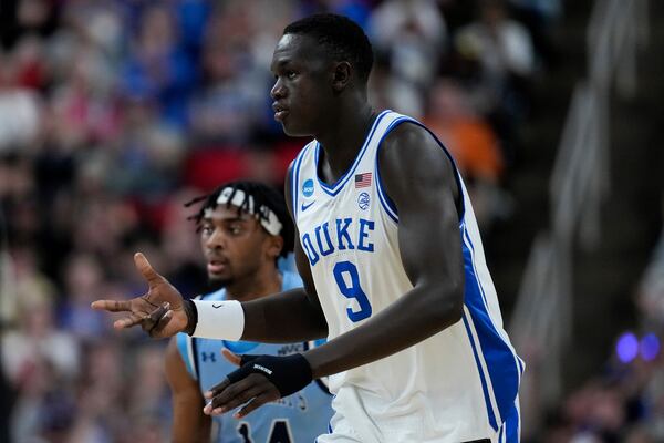 Duke center Khaman Maluach (9) celebrates after making a three-point shot during the first half in the first round of the NCAA college basketball tournament against Mount St. Mary's, Friday, March 21, 2025, in Raleigh, N.C. (AP Photo/Stephanie Scarbrough)