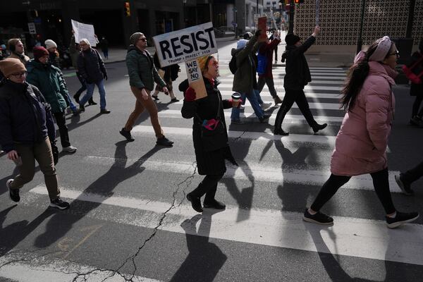 Protesters demonstrate against Project 2025, in Philadelphia, Wednesday, Feb. 5, 2025. (AP Photo/Matt Rourke)