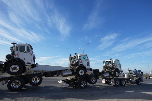 A truck pulls newly assembled truck cabs across the border bridge, from Mexico into the United States, from Mexicali, Mexico, Monday, Feb. 3, 2025. (AP Photo/Fernando Llano)