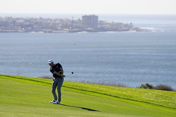 Hayden Springer hits his second shot on the fourth hole of the South Course at Torrey Pines during the second round of the Farmers Insurance Open golf tournament Thursday, Jan. 23, 2025, in San Diego. (AP Photo/Denis Poroy)