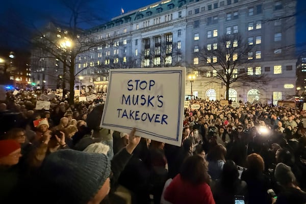 FILE - People protest during a rally outside the Treasury Department in Washington, Feb. 4, 2025. (AP Photo/Jose Luis Magana, File)