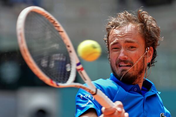 Russia's Daniil Medvedev returns the ball against Casper Ruud of Norway during the Madrid Open tennis tournament in Madrid, Spain, Thursday, May 1, 2025. (AP Photo/Manu Fernandez)