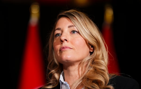 Canada's Minister of Foreign Affairs Melanie Joly speaks to reporters prior to a meeting during a cabinet retreat at Chateau Montebello in Montebello, Quebec, Monday, Jan. 20, 2025. (Sean Kilpatrick/The Canadian Press via AP)