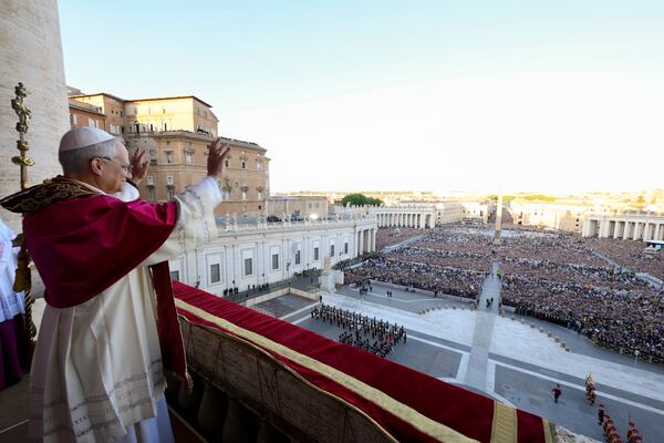 Newly elected Pope Leo XIV waves to faithful and pilgrims gathered in St. Peter's Square shortly after his election, Thursday, May 8, 2025. (Vatican Media via AP)