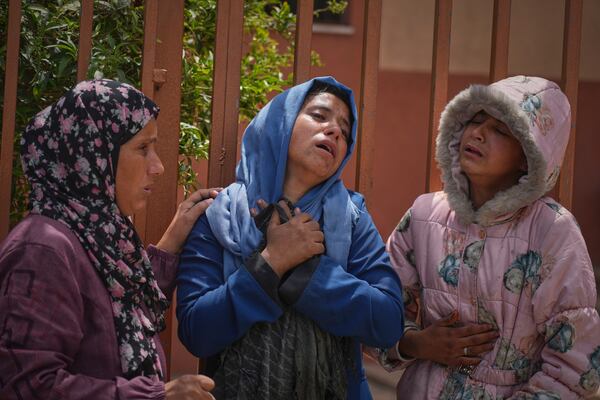 Islam Abu Sahloul, center, mourns the death of her sister Lamia, 32, who was killed when an Israeli army strike hit a house killing at least five people, in Khan Younis, in the southern Gaza Strip, Thursday, May 1, 2025. (AP Photo/Abdel Kareem Hana)