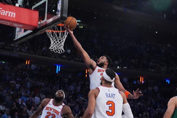 New York Knicks' Karl-Anthony Towns (32) drives to the basket during the first half of Game 6 in the Eastern Conference semifinals of the NBA basketball playoffs against the Boston Celtics Friday, May 16, 2025, in New York. (AP Photo/Frank Franklin II)