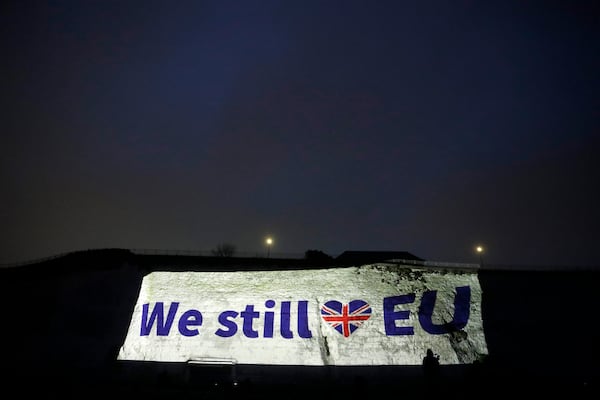 FILE - A projection appears on a cliff in Ramsgate, southern England, Friday, Jan. 31, 2020. (AP Photo/Matt Dunham, File)