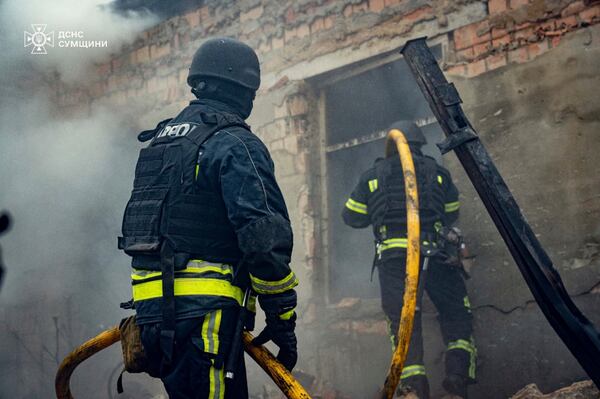 In this photo provided by the Ukrainian Emergency Service, firefighters put out the fire following a Russian attack in Sumy, Ukraine, Tuesday, March 25, 2025. (Ukrainian Emergency Service via AP)