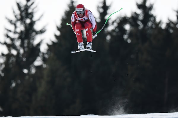 Austria's Vincent Kriechmayr speeds down the course during a men's downhill race, at the Alpine Ski World Championships, in Saalbach-Hinterglemm, Austria, Sunday, Feb. 9, 2025. (AP Photo/Marco Trovati)