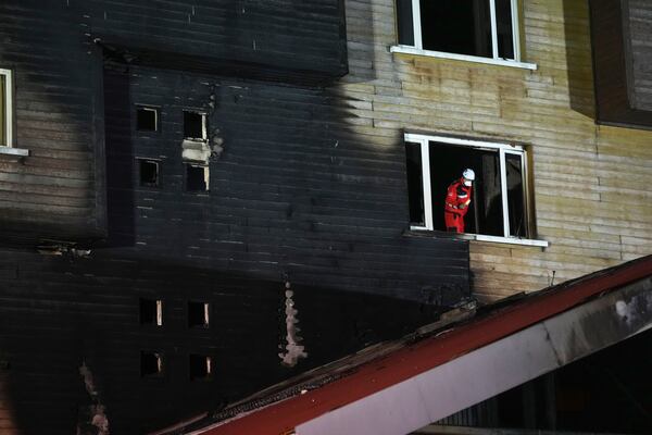 Firefighters and emergency teams work after a fire that broke out at a hotel in the ski resort of Kartalkaya, located in Bolu province, northwest Turkey, on Tuesday, Jan. 21, 2025. (AP Photo/Francisco Seco)