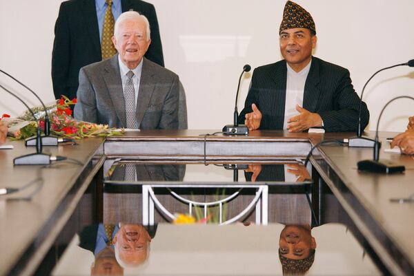 FILE - Former U.S. President Jimmy Carter meets with Bhoj Raj Pokhrel, Nepal's chief election official, on April 8, 2008, in Katmandu, Nepal. (AP Photo/Ed Wray, File)