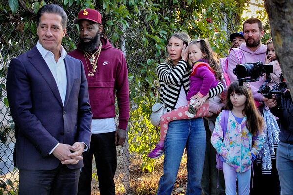 Los Angeles Unified Superintendent Alberto M. Carvalho greets students from Palisades Charter Elementary School upon their arrival at the Brentwood Elementary Science Magnet school in the Brentwood section of Los Angeles on Wednesday, Jan. 15, 2025. (AP Photo/Richard Vogel)