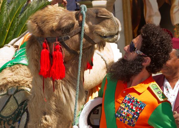 FILE - Actor Sacha Baron Cohen poses with a a camel during a photo call for The Dictator at the 65th international film festival, in Cannes, southern France, Wednesday, May 16, 2012. (AP Photo/Joel Ryan, File)