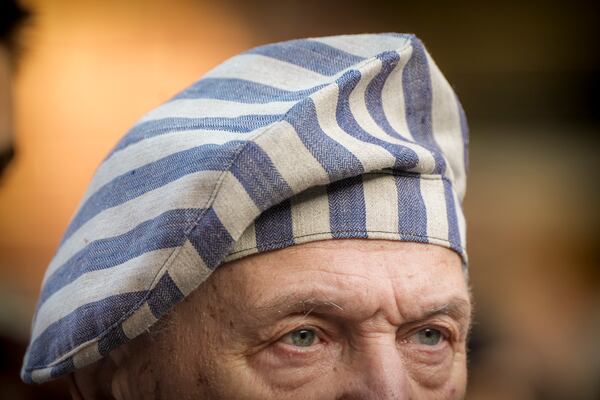 A survivor attends a ceremony at the Auschwitz-Birkenau former Nazi German concentration and extermination camp, in Oswiecim, Poland, Monday, Jan. 27. 2025. (AP Photo/Oded Balilty)