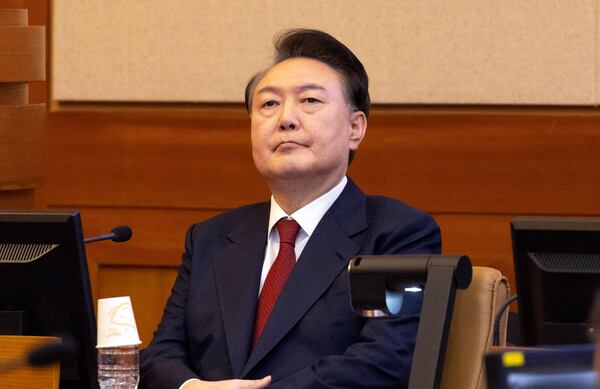 South Korea's impeached President Yoon Suk Yeol attends a hearing of his impeachment trial at the Constitutional Court in Seoul, South Korea, Thursday, Feb. 13, 2025. (Joen Heon-Kyun/Pool Photo via AP)