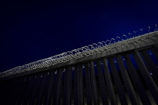 Concertina wire tops a section of a border wall separating Mexico from the United States Tuesday, Jan. 21, 2025, in San Diego. (AP Photo/Gregory Bull)