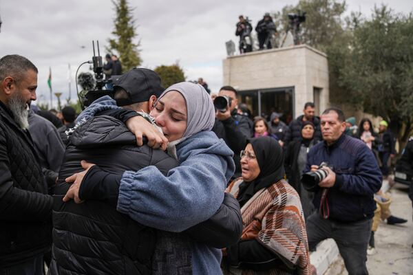 Palestinian prisoners are greeted after being released from Israeli prison following a ceasefire agreement between Israel and Hamas, in the West Bank city of Ramallah, Saturday Feb. 8, 2025. (AP Photo/Mahmoud Illean)