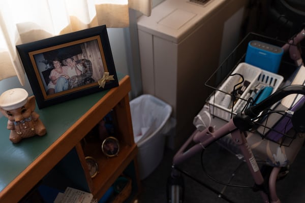 Photos are displayed inside Phyllis Goss' studio apartment at Smith Tower Apartments in Vancouver, Wash., on Monday, March 10, 2025. (AP Photo/Jenny Kane)