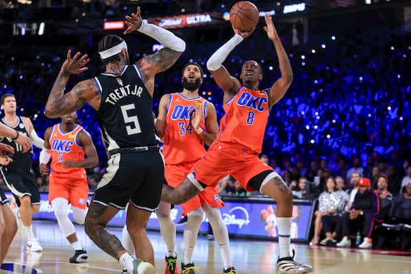 Oklahoma City Thunder forward Jalen Williams (8) shoots against Milwaukee Bucks guard Gary Trent Jr. (5) during the first half of the championship game in the NBA Cup basketball tournament Tuesday, Dec. 17, 2024, in Las Vegas. (AP Photo/Ian Maule)