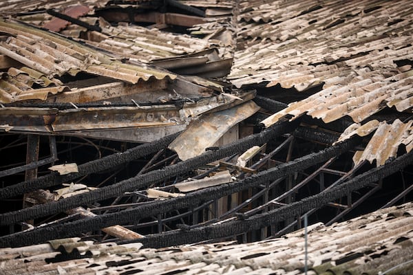 Support beams are charred in the partially collapsed roof of the building of a nightclub, damaged following a massive fire early Sunday in the town of Kocani, North Macedonia, Monday, March 17, 2025, (AP Photo/Armin Durgut)