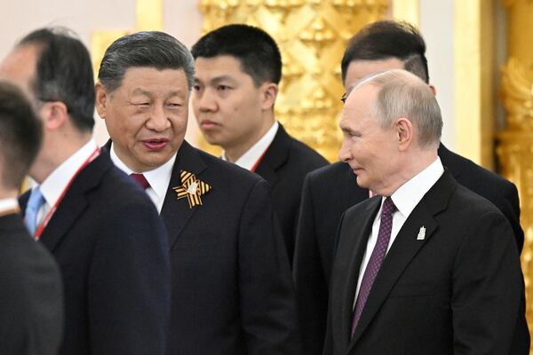 President of Russia Vladimir Putin, right, and President of China Xi Jinping talk during a dinner on behalf of the President of the Russian Federation for heads of foreign delegations in the Grand Palace at the Kremlin in Moscow, Thursday, May 8, 2025, ahead of celebrations of the 80th anniversary of the Soviet Union's victory over Nazi Germany during the World War II. (Sergey Bobylev/Photo host agency RIA Novosti via AP)