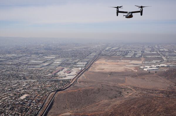 A U.S. Marine Osprey is flown over the border Friday, Jan. 31, 2025, near San Diego. (AP Photo/Jae C. Hong)