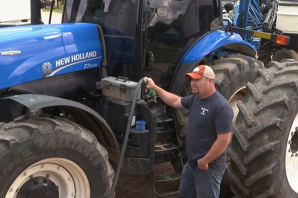 In this image from video, Matt Griggs fills up his tractor with fuel on Monday, May 5, 2025 at his farm in Humboldt, Tenn. Griggs, like many American farmers, is paying close attention to the trade war between the U.S. and China, a critical market for soybeans. (AP photo/Kristin M. Hall)