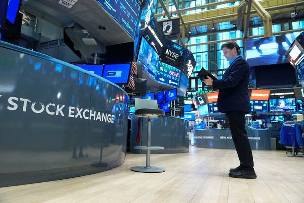 Traders work on the floor at the New York Stock Exchange in New York, Tuesday, Jan. 21, 2025. (AP Photo/Seth Wenig)