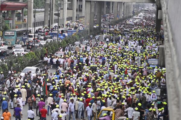 Supporters of Bangladesh's ailing former Prime Minister Khaleda Zia march on a road as they welcome her arrival from London, in Dhaka, Bangladesh, Tuesday, May 6, 2025. (AP Photo/Mahud Hossain Opu)