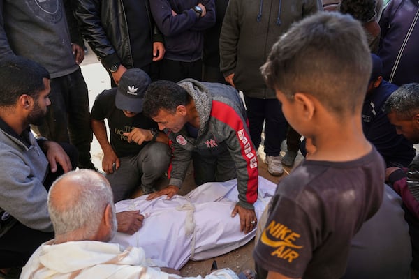 Palestinians mourn over the bodies of their relatives killed by an Israeli airstrike in Beit Lahiya, northern Gaza Strip on Saturday, March 15, 2025. (AP Photo/Jehad Alshrafi)