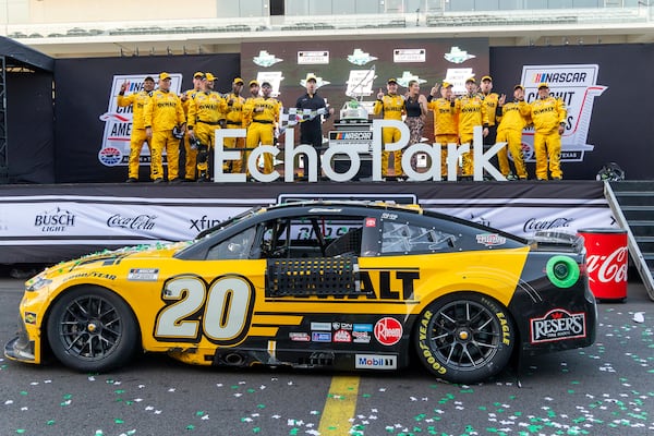 Christopher Bell's team celebrates after a win in a NASCAR Cup Series auto race at Circuit of the Americas in Austin, Texas, Sunday, March 2, 2025. (AP Photo/Stephen Spillman)