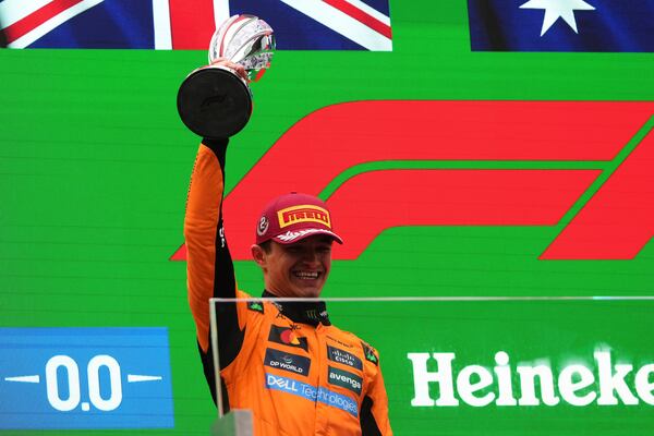 McLaren driver Lando Norris of Britain celebrates second place on the podium after the Chinese Formula One Grand Prix race at the Shanghai International Circuit, Shanghai, Sunday, March 23, 2025. (AP Photo/Andy Wong)