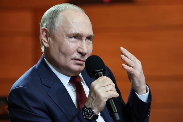 Russian President Vladimir Putin gestures while speaking to students and teachers of the new Secondary Special Music School at the Sirius Park of Science and Art after his phone talk with U.S. President Donald Trump, outside Sochi, Russia, on Monday, May 19, 2025. (Alexander Kazakov, Sputnik, Kremlin Pool Photo via AP)