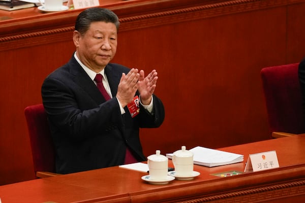 Chinese President Xi Jinping applauds during the opening session of the National People's Congress (NPC) at the Great Hall of the People in Beijing, China, Wednesday, March 5, 2025. (AP Photo/Andy Wong)