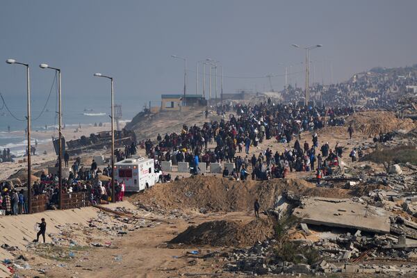 Displaced Palestinians walk on a road in central Gaza to return to their homes in the northern Gaza Strip, Wednesday, Jan. 29, 2025. (AP Photo/Abdel Kareem Hana)