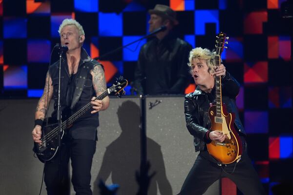 Mike Dirnt, left, and Billie Joe Armstrong of Green Day perform during the FireAid benefit concert on Thursday, Jan. 30, 2025, at The Forum in Inglewood, Calif. (AP Photo/Chris Pizzello)